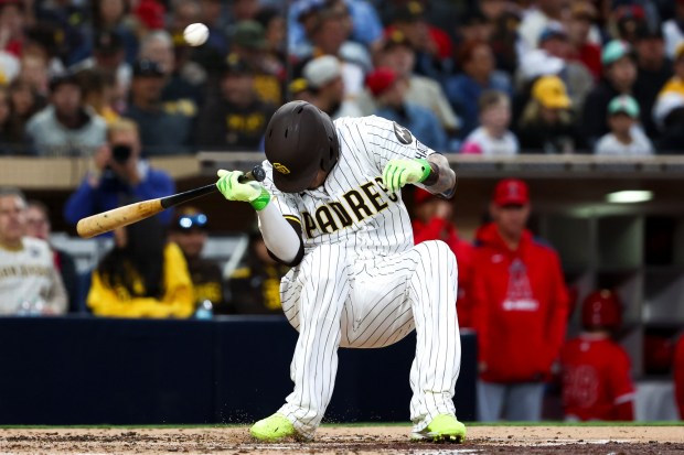 San Diego Padres third baseman Manny Machado ducks to avoid being hit by a pitch during the fourth inning against the Los Angeles Angels at Petco Park on Tuesday, May 13, 2025 in San Diego, CA. (Meg McLaughlin / The San Diego Union-Tribune)