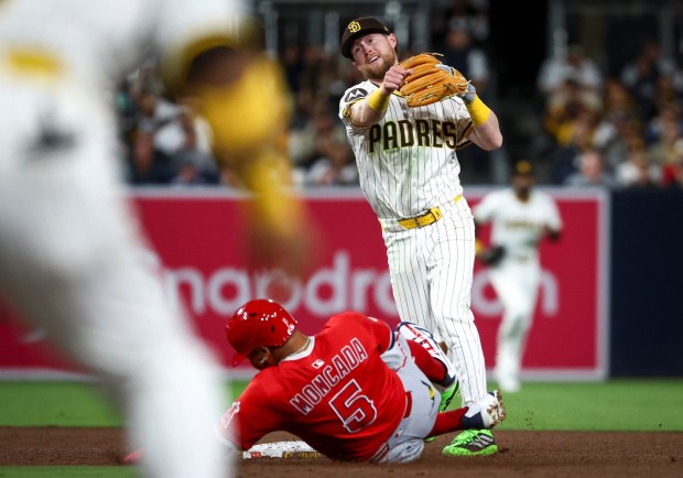 Jake Cronenworth tags out Los Angeles Angels third baseman Yoan Moncada and turns a double play during the sixth inning at Petco Park on Tuesday, May 13, 2025 in San Diego, CA. (Meg McLaughlin / The San Diego Union-Tribune)