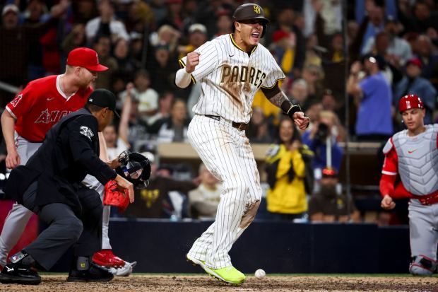San Diego Padres third baseman Manny Machado celebrates scoring the tying run against the Los Angeles Angels during the eighth inning at Petco Park on Tuesday, May 13, 2025 in San Diego, CA. (Meg McLaughlin / The San Diego Union-Tribune)