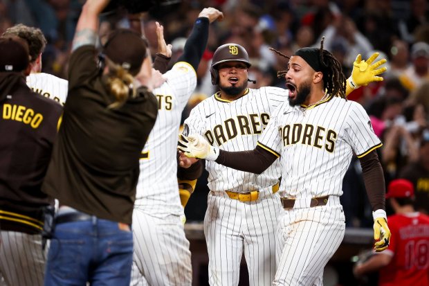 San Diego Padres right fielder Fernando Tatis Jr., center, and teammates celebrate after Tatis' game-winning home run against the Los Angeles Angels during the ninth inning at Petco Park on Tuesday, May 13, 2025 in San Diego, CA. (Meg McLaughlin / The San Diego Union-Tribune)