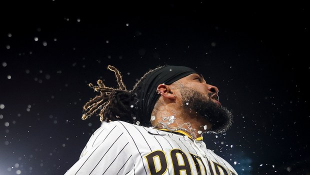 San Diego Padres' Fernando Tatis Jr. is doused in sports drink after his game-win ing home run against the Los Angeles Angels at Petco Park on Tuesday, May 13, 2025 in San Diego, CA. (Meg McLaughlin / The San Diego Union-Tribune)