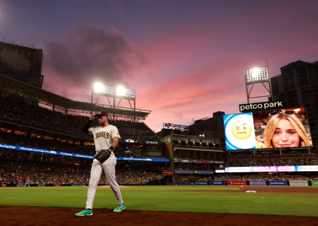 San Diego Padres' Jackson Merrill walks to the dugout between innings against the Los Angeles Angels as the sun sets at Petco Park on Wednesday, May 14, 2025. (K.C. Alfred / The San Diego Union-Tribune)