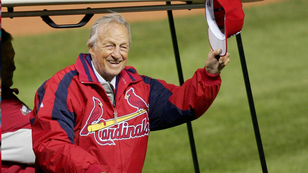 St. Louis Cardinals legend Stan Musial tips his hat to the crowd before throwing out the ceremonial first pitch before game 5 of the World Series between the Cardinals and the Detroit Tigers at Busch Stadium in St. Louis, Missouri.