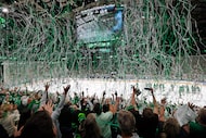 Paper streamers fall from the rafters as Dallas Stars fans celebrate their Game 7 win over...