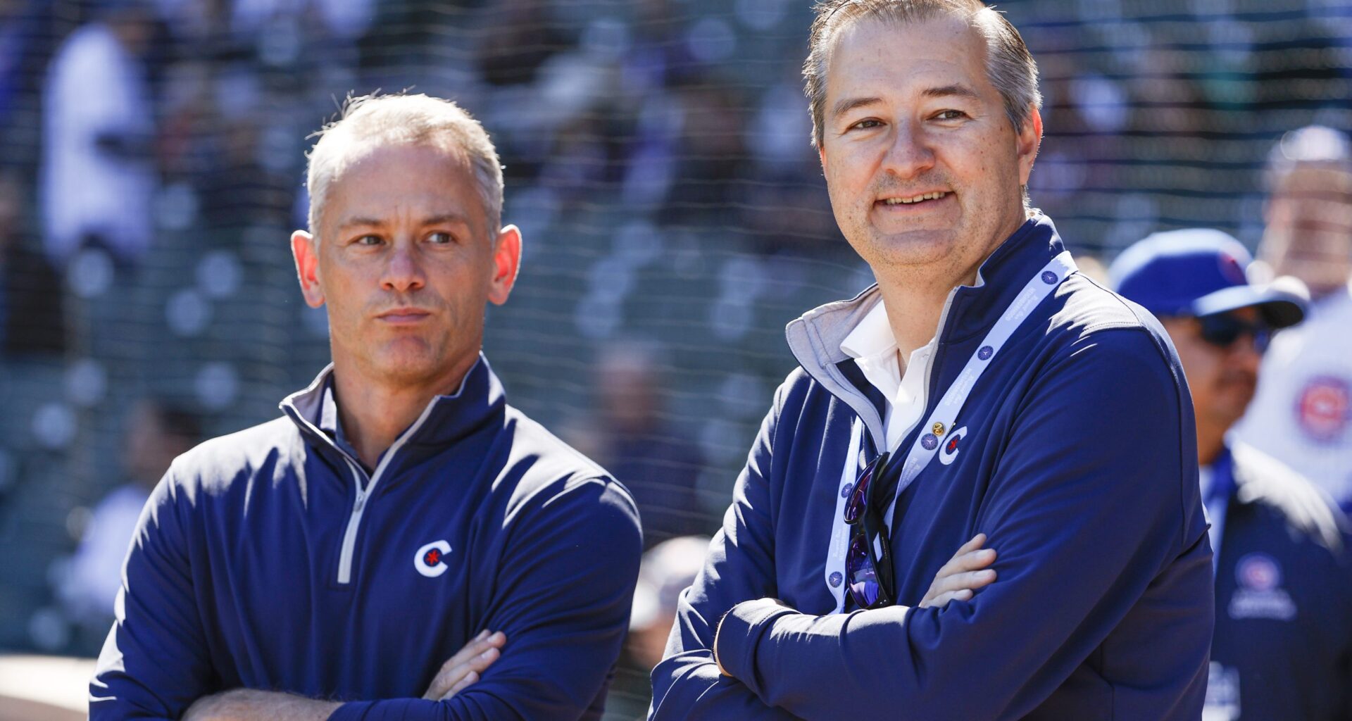 Chicago Cubs Chairman Tom Ricketts (R) smiles next to Chicago Cubs President of baseball operations Jed Hoyer (L) before a baseball game between the Chicago Cubs and Cincinnati Reds at Wrigley Field.