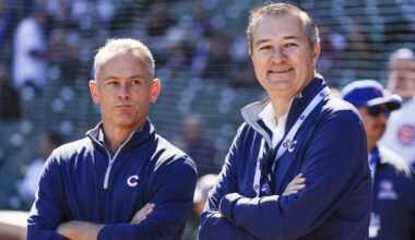 Chicago Cubs Chairman Tom Ricketts (R) smiles next to Chicago Cubs President of baseball operations Jed Hoyer (L) before a baseball game between the Chicago Cubs and Cincinnati Reds at Wrigley Field.