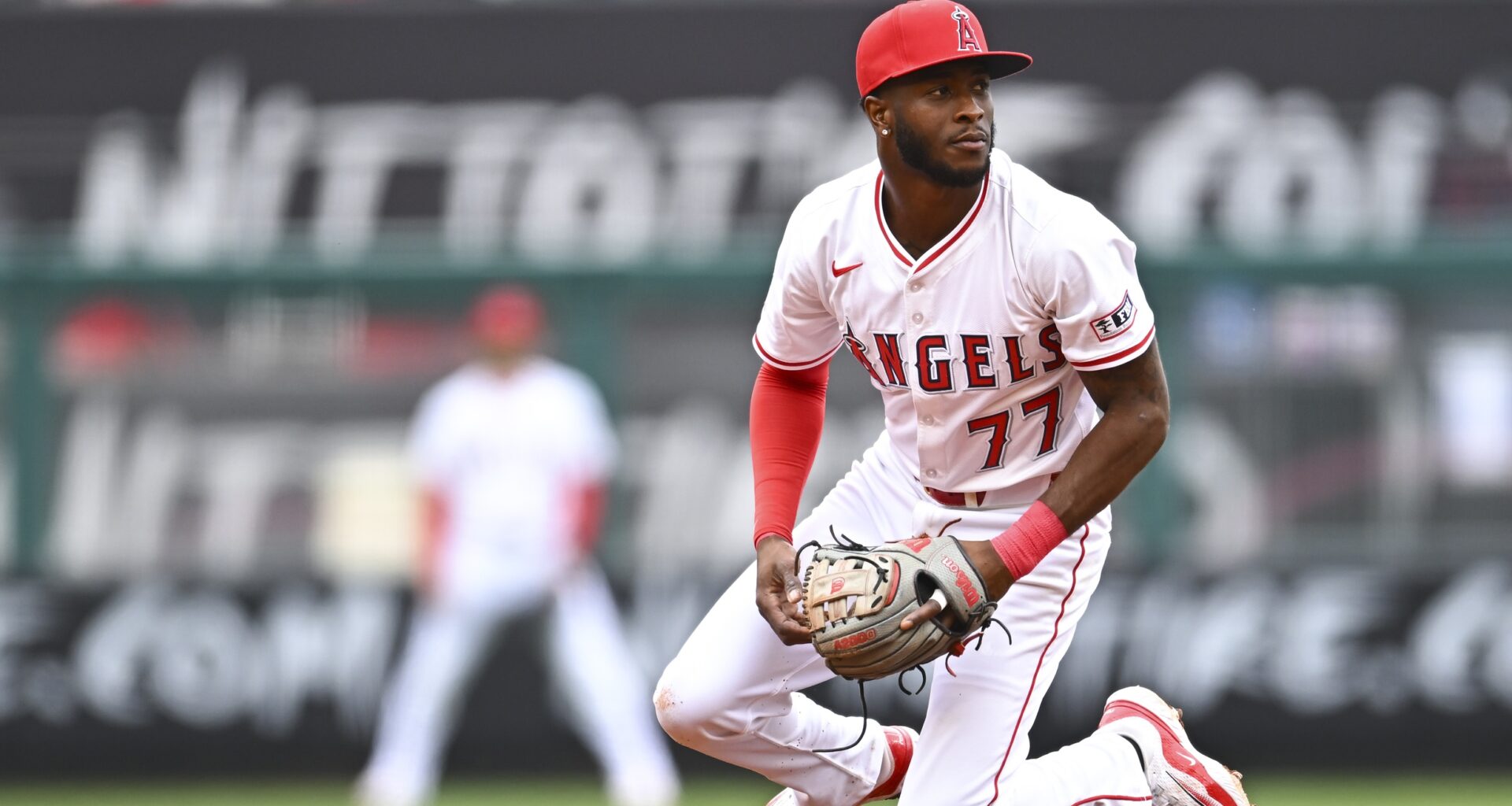Los Angeles Angels second baseman Tim Anderson (77) looks to throw the ball against the Detroit Tigers during the fourth inning at Angel Stadium.