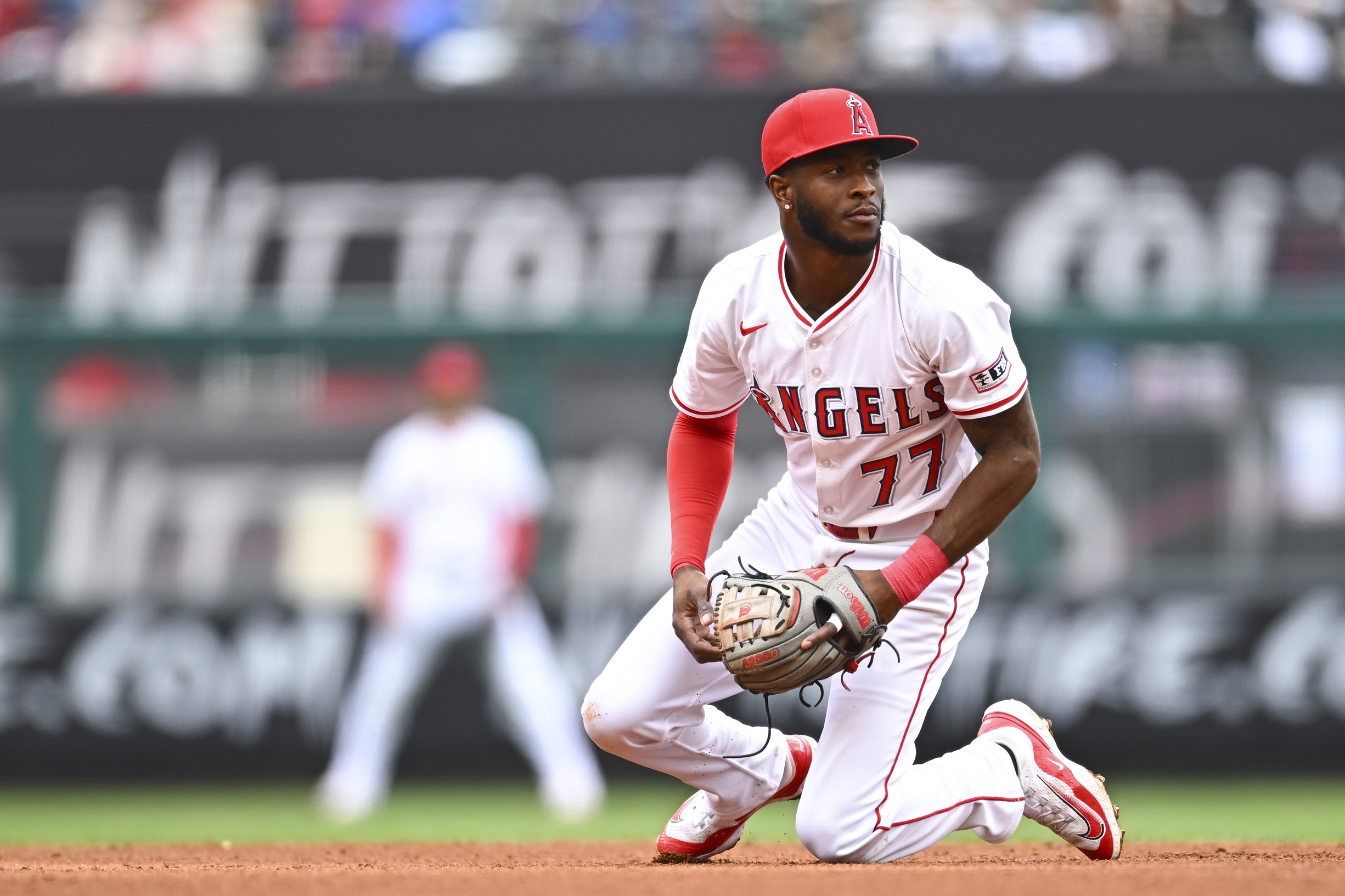 Los Angeles Angels second baseman Tim Anderson (77) looks to throw the ball against the Detroit Tigers during the fourth inning at Angel Stadium.
