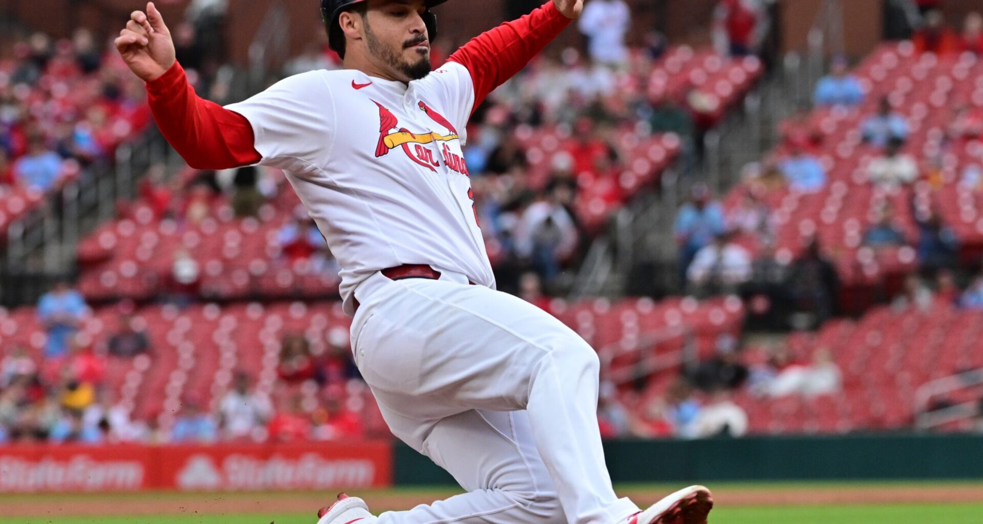 St. Louis Cardinals third baseman Nolan Arenado (28) slides safely into third base in the third inning against the New York Mets at Busch Stadium.