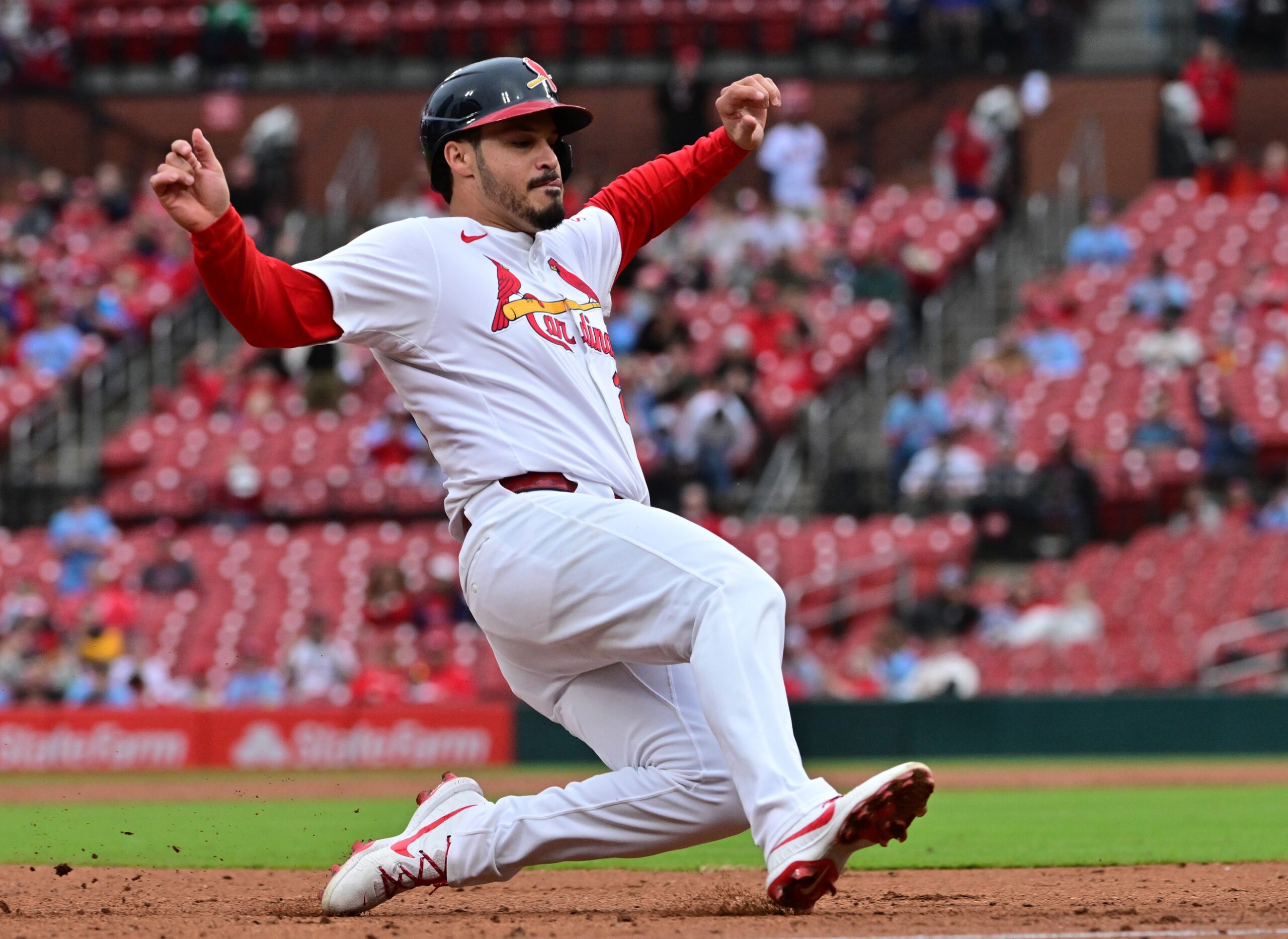St. Louis Cardinals third baseman Nolan Arenado (28) slides safely into third base in the third inning against the New York Mets at Busch Stadium.