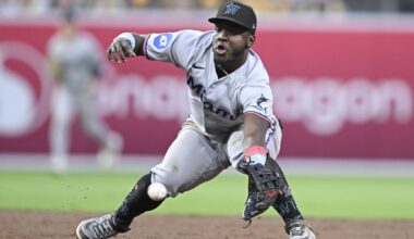 Miami Marlins second baseman Ronny Simon (41) canÕt make the stop on a ball hit by San Diego Padres shortstop Xander Bogaerts (2) during the third inning at Petco Park. Simon was charged with an error on the play.