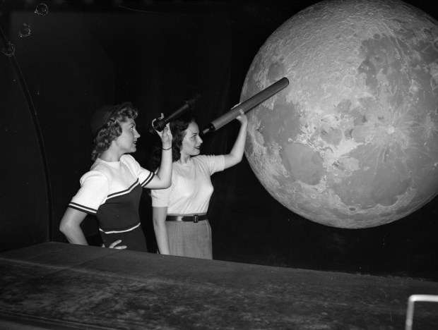 Florine Seres and Nancy Wright, NBC television stars, look at...