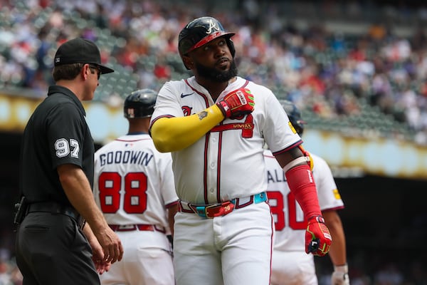 Braves designated hitter Marcell Ozuna reacts after hitting a sacrifice fly on Thursday against the Nationals.