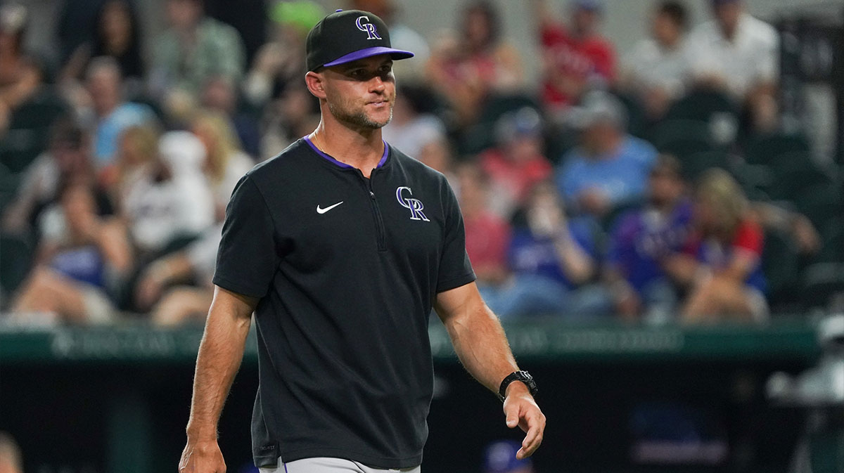 Colorado Rockies interim manager Warren Schaeffer (34) walks off the field after a pitching change during the eighth inning against the Texas Rangers at Globe Life Field.