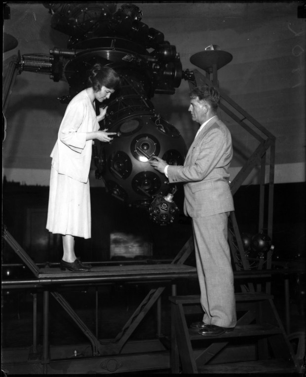 Professor Philip Fox, director of the Adler Planetarium, right, and...