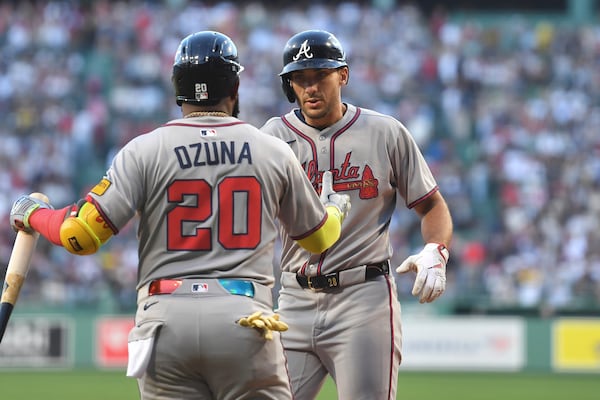 Braves first baseman Matt Olson celebrates with Marcell Ozuna after a two-run homer against the Red Sox.