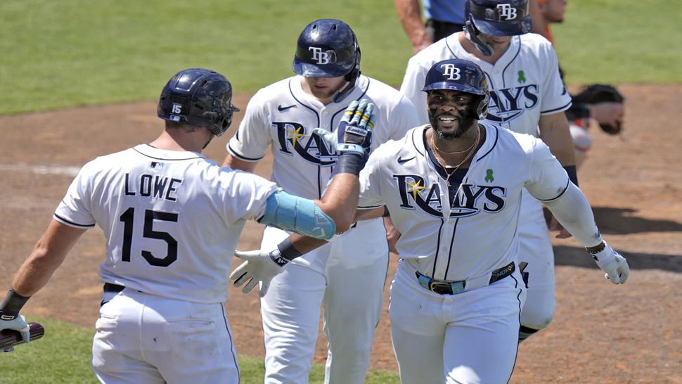 Tampa Bay designated hitter Yandy Diaz celebrates with teammates after hitting a three-run home run in the eighth inning on Wednesday.