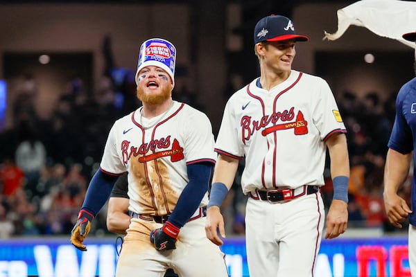 Braves outfielder Alex Verdugo (left) celebrates after his walk-off RBI single.