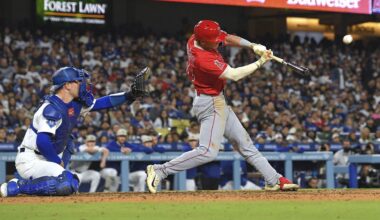 Los Angeles Angels' Logan O'Hoppe, hits a three-run home run as Los Angeles Dodgers catcher Dalton Rushing watches during the seventh inning of a baseball game Saturday, May 17, 2025, in Los Angeles. (AP Photo/Mark J. Terrill)