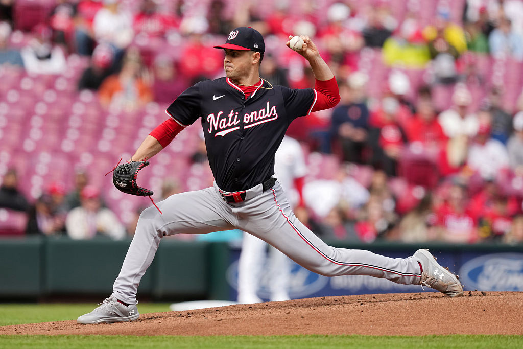 Behind Gore's gutsy outing, Nats survive rain to beat Reds