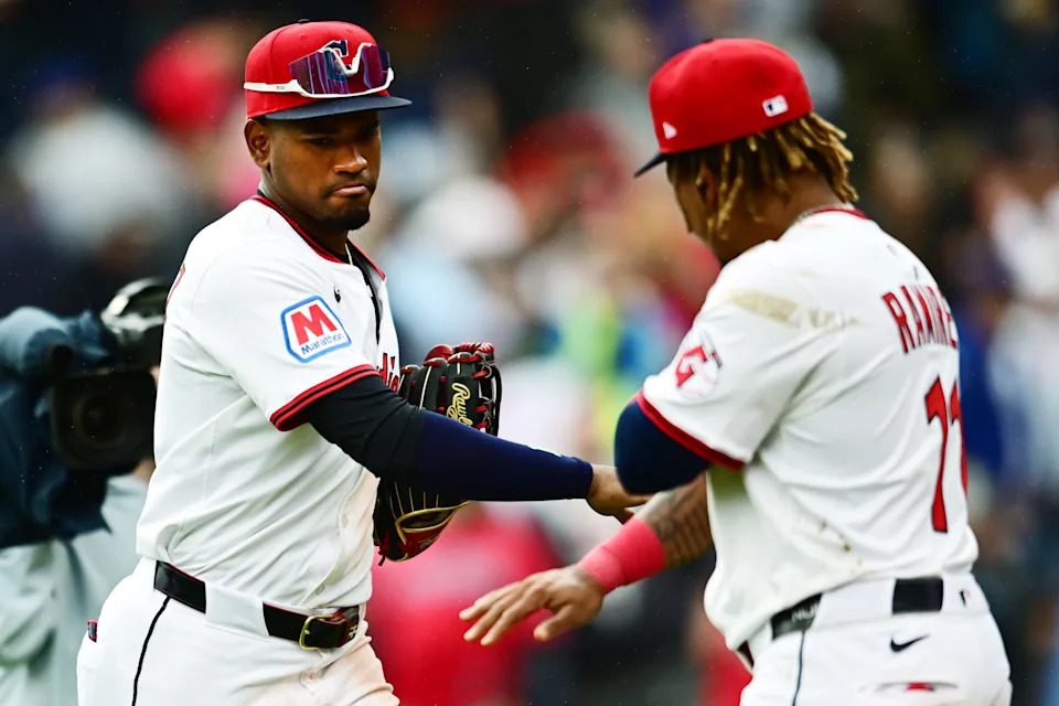 Angel Martinez (left) and Jose Ramirez celebrate after the Guardians beat the Dodgers, May 28, 2025, in Cleveland. Martinez hit a go-ahead home run in the eighth in a 7-4 comeback win, while Ramirez extended his hit streak to 21 games in a three-hit performance.