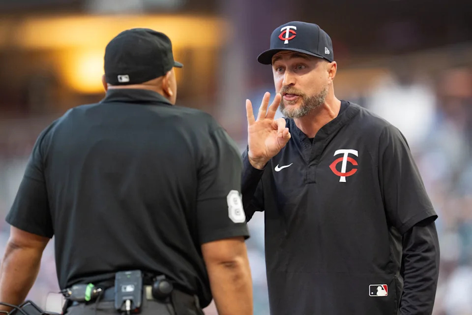 Minnesota Twins manager Rocco Baldelli and home plate umpire Adrian Johnson argueMatt Blewett-Imagn Images