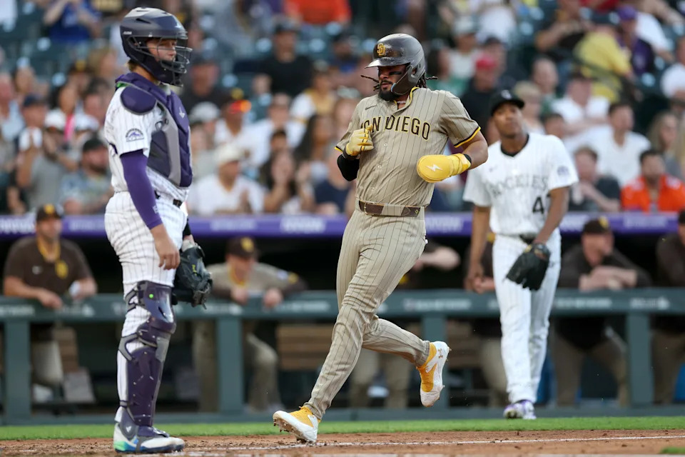 DENVER, COLORADO - MAY 10: Fernando Tatis Jr. #23 of the San Diego Padres scores on a Luis Arraez triple against the Colorado Rockies in the fourth inning at Coors Field on May 10, 2025 in Denver, Colorado. (Photo by Matthew Stockman/Getty Images)