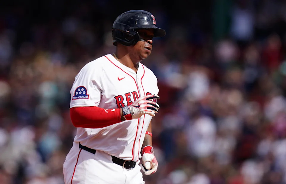 Boston Red Sox designated hitter Rafael Devers (11) hits a home run against the Texas Rangers in the seventh inning at Fenway Park.David Butler II-Imagn Images