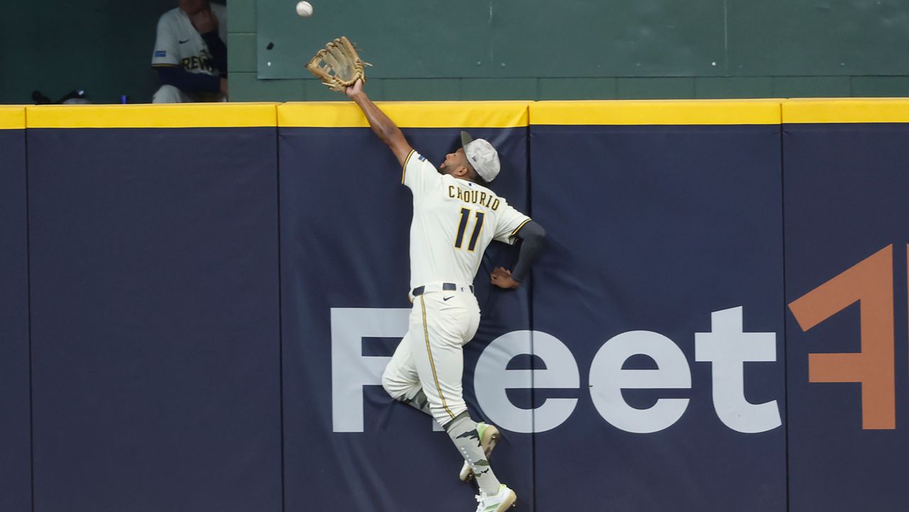 Milwaukee Brewers outfielder Jackson Chourio catches a ball hit by Minnesota Twins' Royce Lewis during the eighth inning of a baseball game, Sunday, May 18, 2025, in Milwaukee.