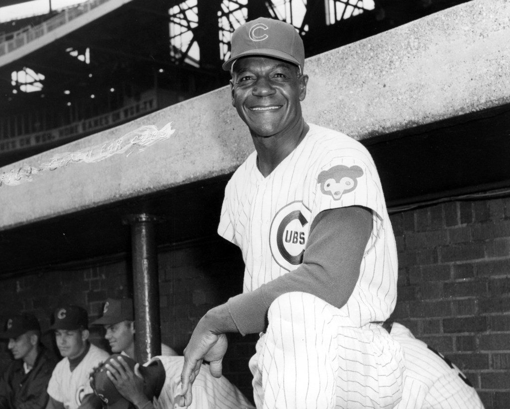 Cubs hire Buck O'Neil who becomes first Black coach in major league history