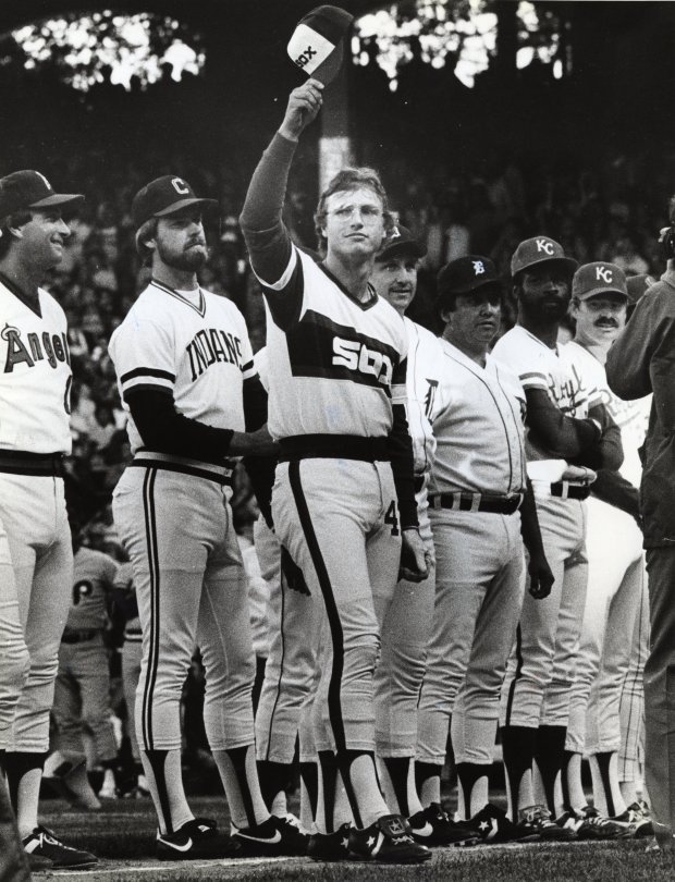 White Sox player Ron Kittle, center, raises his cap to fans during introductions at the All Star game on July 6, 1983. (Paul Gero/Chicago Tribune)