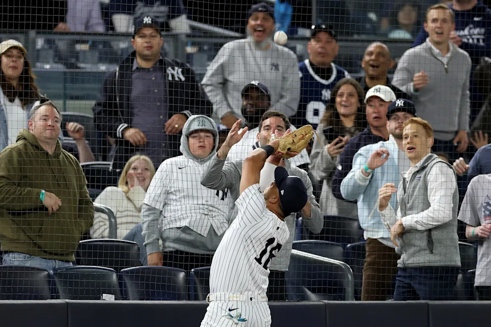 NEW YORK, NEW YORK - MAY 20: Oswald Peraza #18 of the New York Yankees catches a foul ball against the Texas Rangers during the sixth inning at Yankee Stadium on May 20, 2025 in New York City.