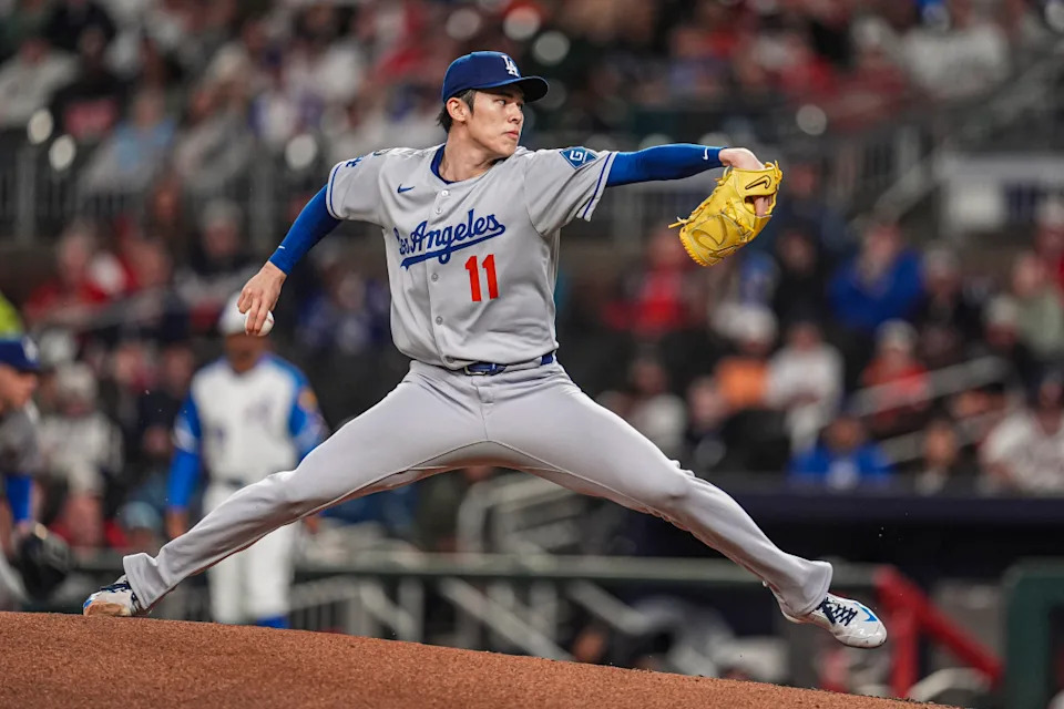 Los Angeles Dodgers starting pitcher Roki Sasaki (11) pitches against the Atlanta Braves during the first inning at Truist Park.Dale Zanine-Imagn Images