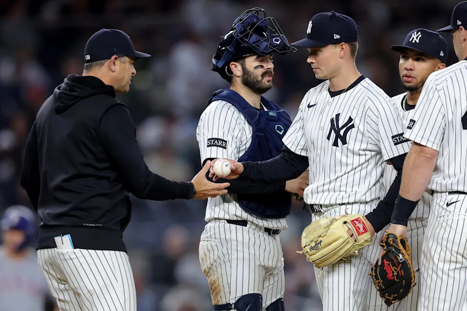 May 20, 2025; Bronx, New York, USA; New York Yankees manager Aaron Boone (17) takes the ball from New York Yankees starting pitcher Will Warren (98) during a pitching change during the sixth inning against the Texas Rangers at Yankee Stadium.