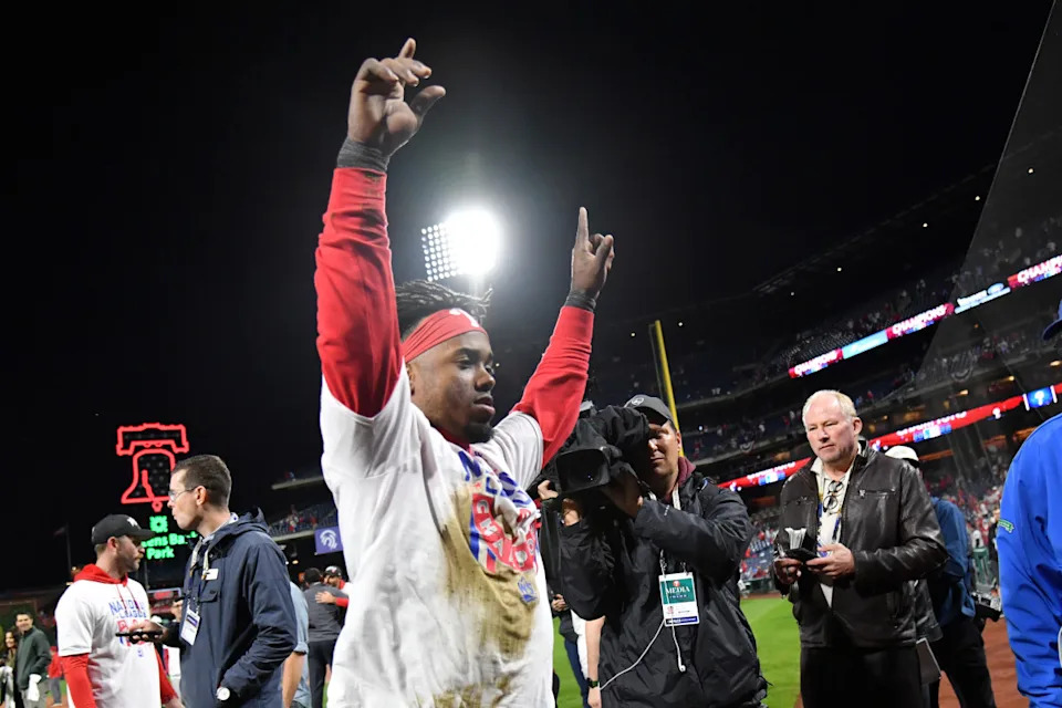 Philadelphia Phillies second baseman Jean Segura leaves the field celebration after their 4-3 win over the San Diego Padres to win the National League Pennant in game five of the NLCS for the 2022 MLB Playoffs at Citizens Bank ParkEric Hartline-Imagn Images
