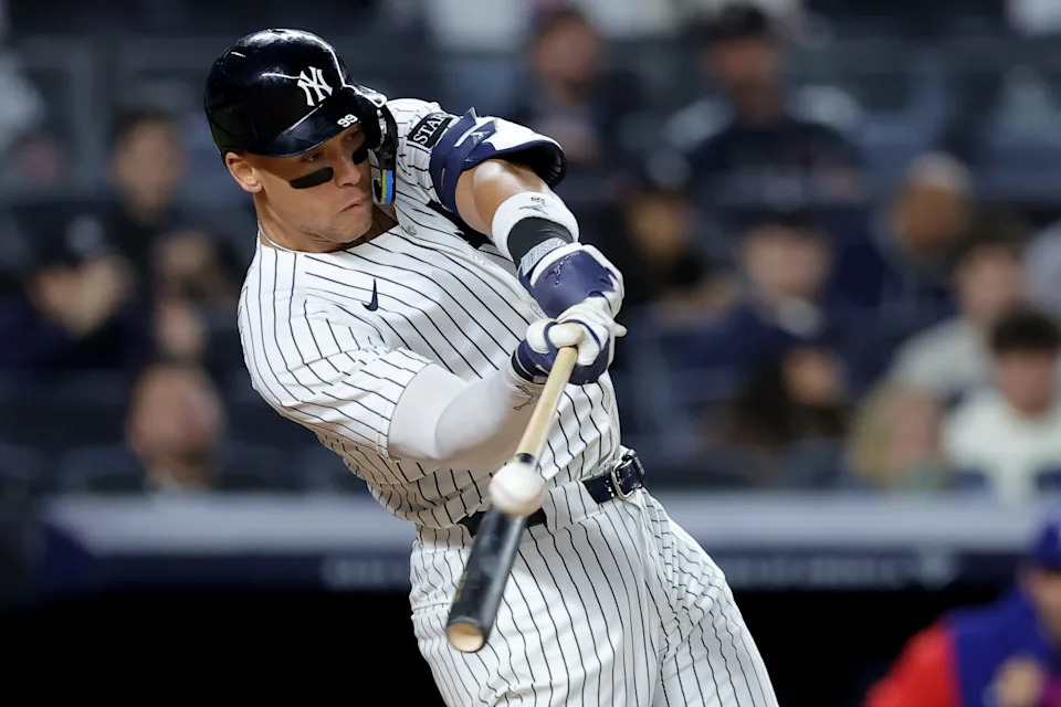 May 20, 2025; Bronx, New York, USA; New York Yankees right fielder Aaron Judge (99) hits a two run home run against the Texas Rangers during the eighth inning at Yankee Stadium.