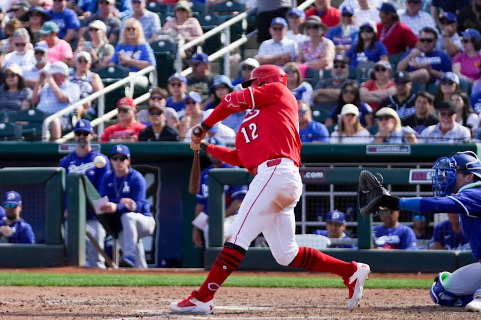 Cincinnati Reds outfielder Austin Hays hits a homer in the fifth inning of a Cactus League game between the Cincinnati Reds and Los Angeles Dodgers, Monday, Feb. 24, 2025, at Goodyear Ballpark in Goodyear, Ariz.