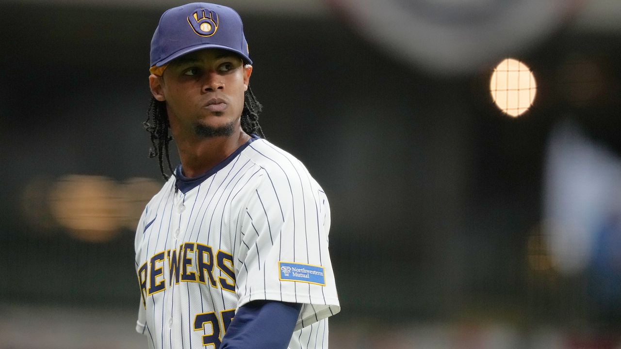 Milwaukee Brewers' Elvin Rodriguez looks back during the fourth inning of a baseball game against the Cincinnati Reds, Saturday, April 5, 2025, in Milwaukee