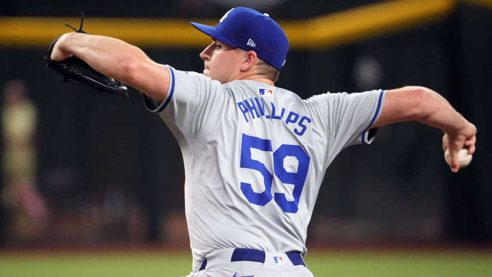 Los Angeles Dodgers pitcher Evan Phillips (59) pitches against the Arizona Diamondbacks during the ninth inning at Chase Field.