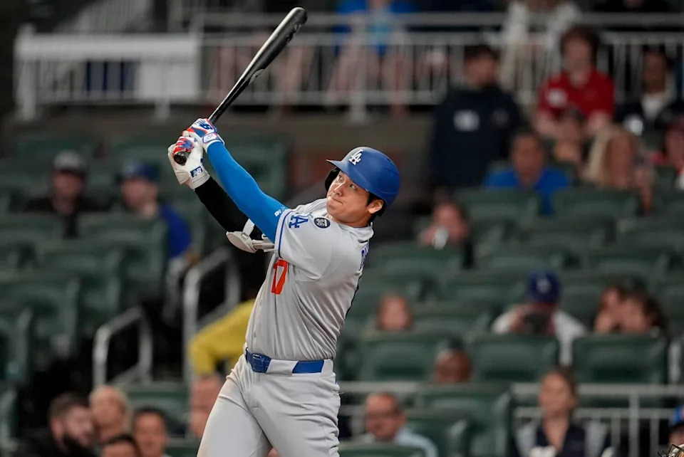 Dodgers star Shohei Ohtani hits a solo home run in the third inning against the Braves on Saturday.