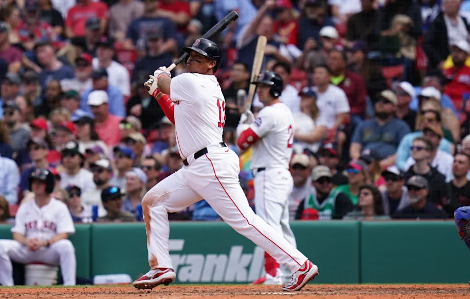 Boston Red Sox designated hitter Rafael Devers (11) hits a home run against the Texas Rangers in the seventh inning at Fenway Park.David Butler II-Imagn Images