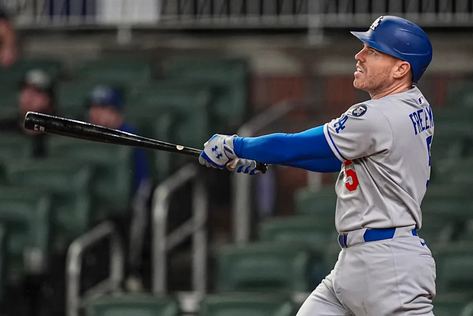 Los Angeles Dodgers first baseman Freddie Freeman launches a three-run homer against the Atlanta Braves at Truist Park.Dale Zanine-Imagn Images
