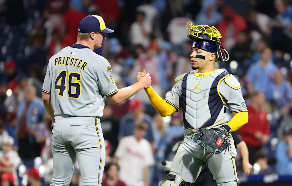PHILADELPHIA, PENNSYLVANIA - MAY 30: Quinn Priester #46 of the Milwaukee Brewers is congratulated by teammate William Contreras #24 after winning the game against the Philadelphia Phillies at Citizens Bank Park on May 30, 2025 in Philadelphia, Pennsylvania. The Brewers won 6-2. (Photo by Hunter Martin/Getty Images)