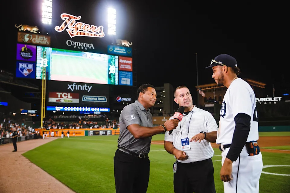 Carlos Guillén translates a postgame interview at Comerica Park.