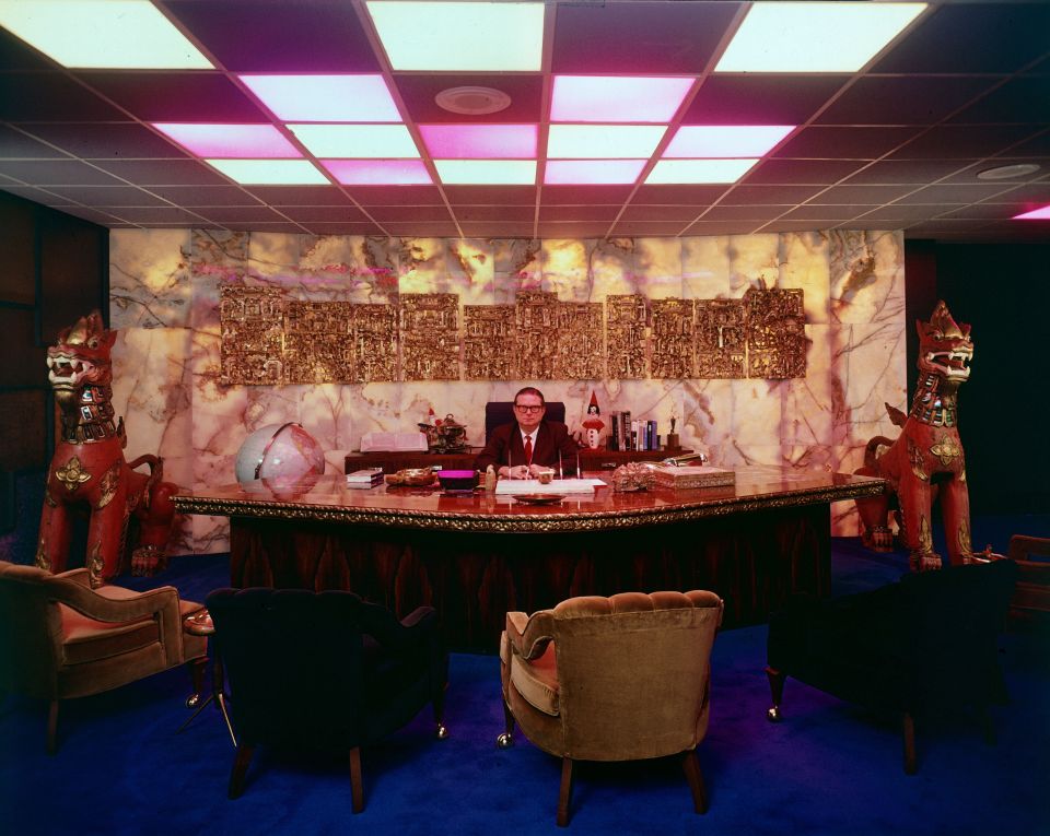 Judge Roy Hofheinz sitting at his desk in his opulent office at the Houston Astrodome.