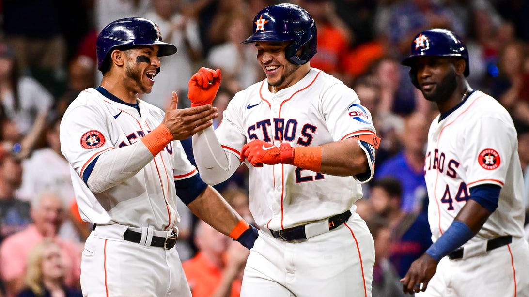 HOUSTON, TEXAS - JUNE 04: Yainer Diaz #21 celebrates with Jeremy Peña #3 of the Houston Astros after hitting a three-run home run in the third inning against the St. Louis Cardinals at Minute Maid Park on June 04, 2024 in Houston, Texas.