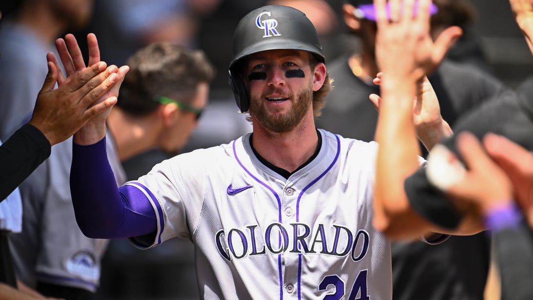 CHICAGO, ILLINOIS - JUNE 30: Ryan McMahon #24 of the Colorado Rockies celebrates in the dugout after scoring in the second inning from a balk from Garrett Crochet of the Chicago White Sox at Guaranteed Rate Field on June 30, 2024 in Chicago, Illinois.