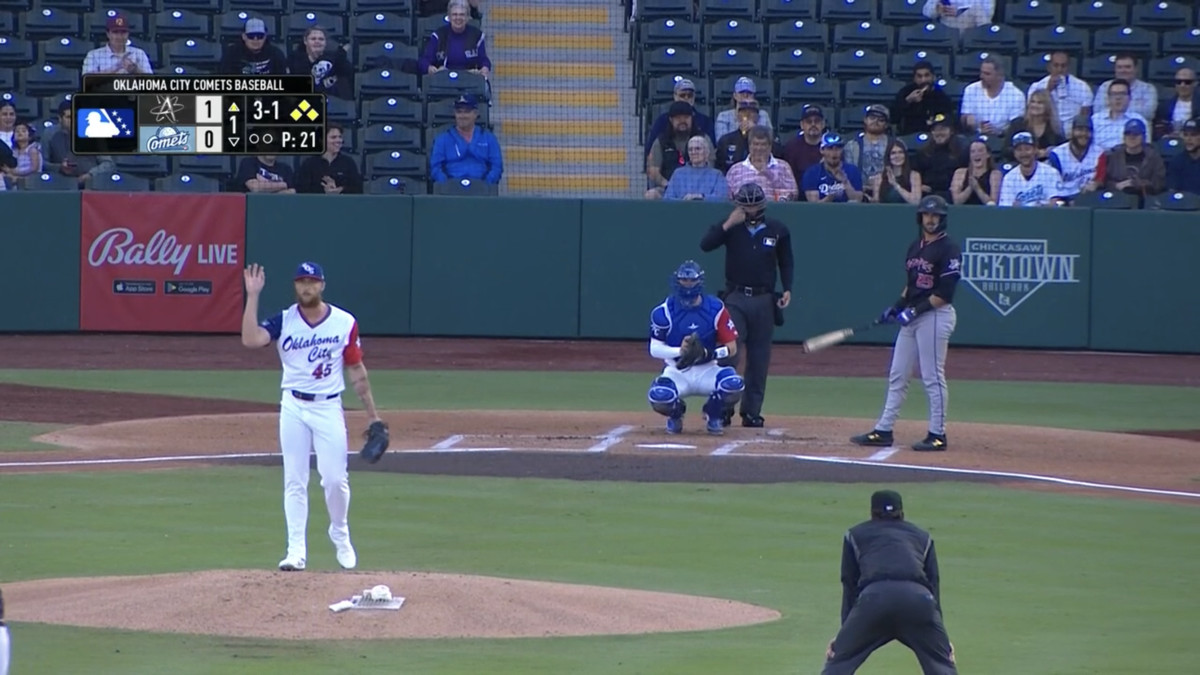 Dodgers pitcher Michael Kopech acknowledges the Triple-A Oklahoma City crowd after throwing a strike, snapping a string of 18 consecutive balls pitched by Kopech in the first game of his minor league rehab assignment.