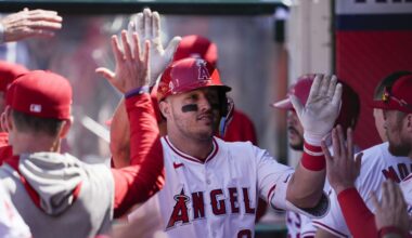 Los Angeles Angels designated hitter Mike Trout celebrates in the dugout after hitting a home run during the sixth inning of a baseball game against the Baltimore Orioles in Anaheim, Calif., Wednesday, April 24, 2024. (AP Photo/Ashley Landis)