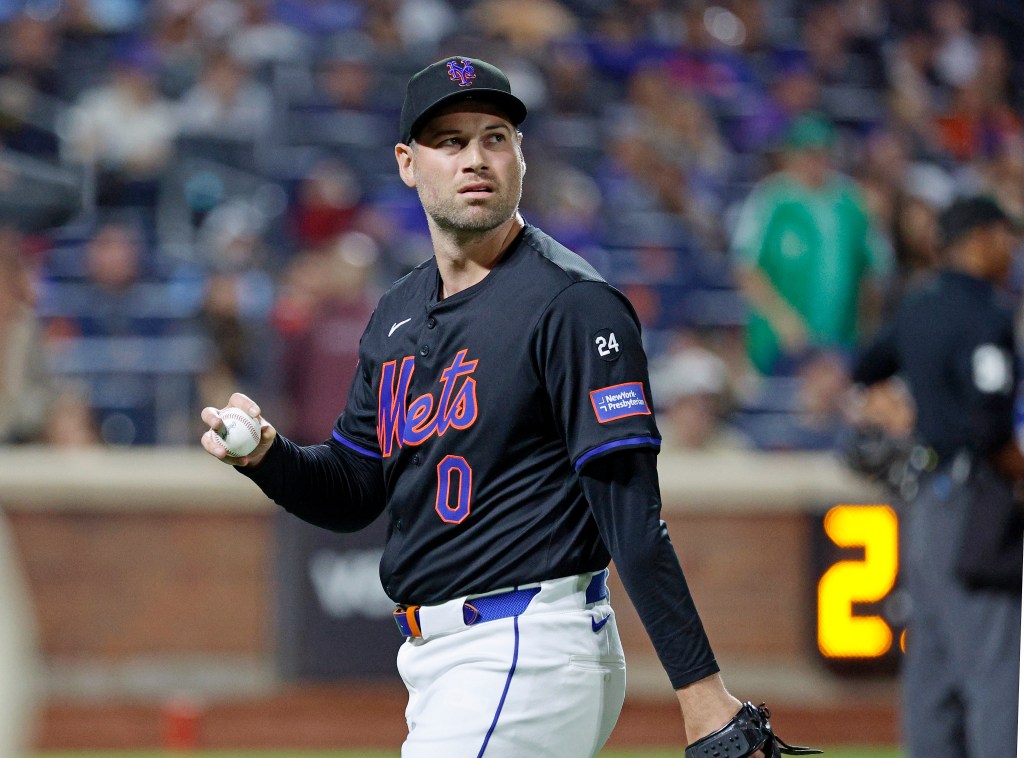 Mets pitcher Adam Ottavino reacts as  he walks to the dugout during a 2024 game.